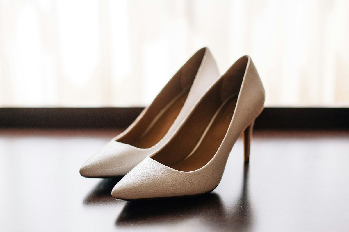 Pair of ivory pointed-toe heels